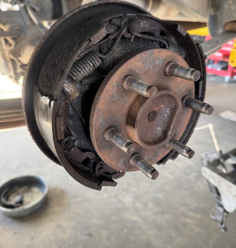 Drum brake shoes, springs and hub on a truck with the drum removed